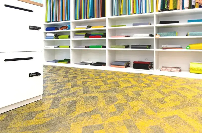 Library floor in woven vinyl acoustic modular carpet tiles