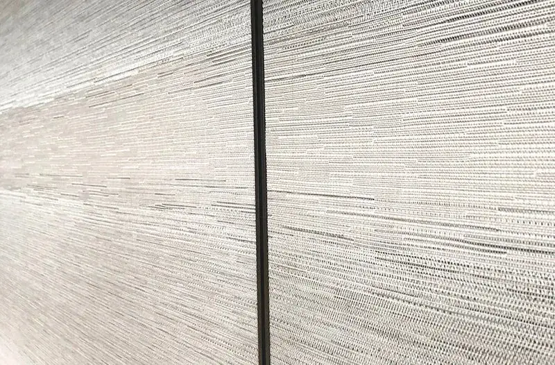 Wipe-clean woven vinyl wallcovering surface for healthcare interiors