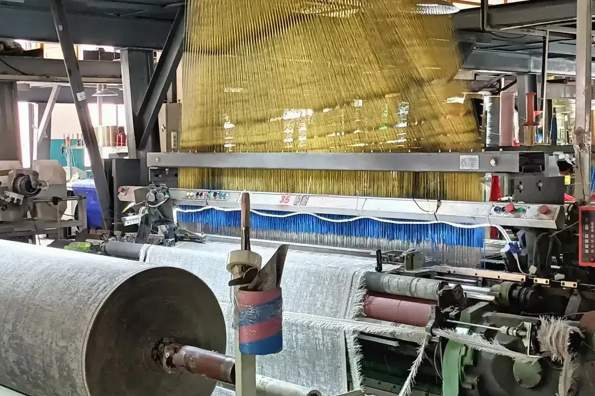 Weaving on the loom at the woven vinyl production base in Zhejiang